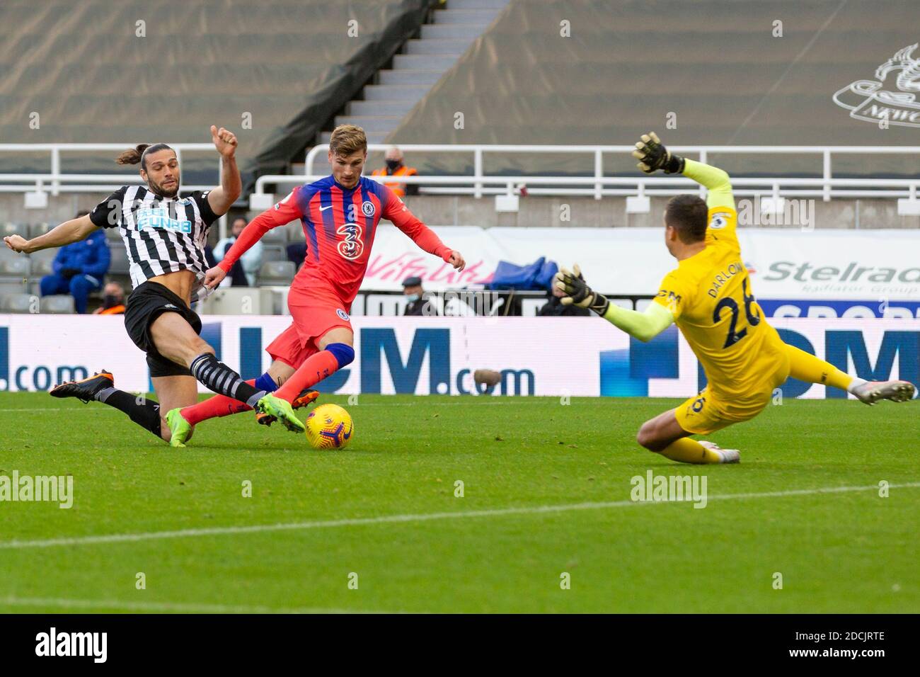 NEWCASTLE UPON TYNE, ENGLAND - NOVEMBER 21: Timo Werner of Chelsea  takes the ball around Andy Carroll of Newcastle and Karl Darlow of Newcastle but his effort is ruled offside during the Premier League match between Newcastle United and Chelsea at St. James Park on November 21, 2020 in Newcastle upon Tyne, United Kingdom. Sporting stadiums around the UK remain under strict restrictions due to the Coronavirus Pandemic as Government social distancing laws prohibit fans inside venues resulting in games being played behind closed doors. (Photo by MB Media) Stock Photo