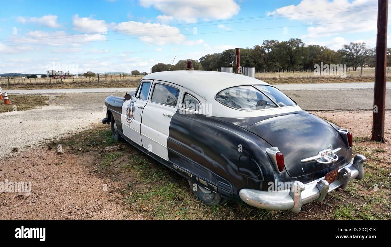 Frederickburg,Texas - Nov.11,2020   The rear end of a 1950 Hudson Super 6 police car with a 1950 Texas license plate. Stock Photo