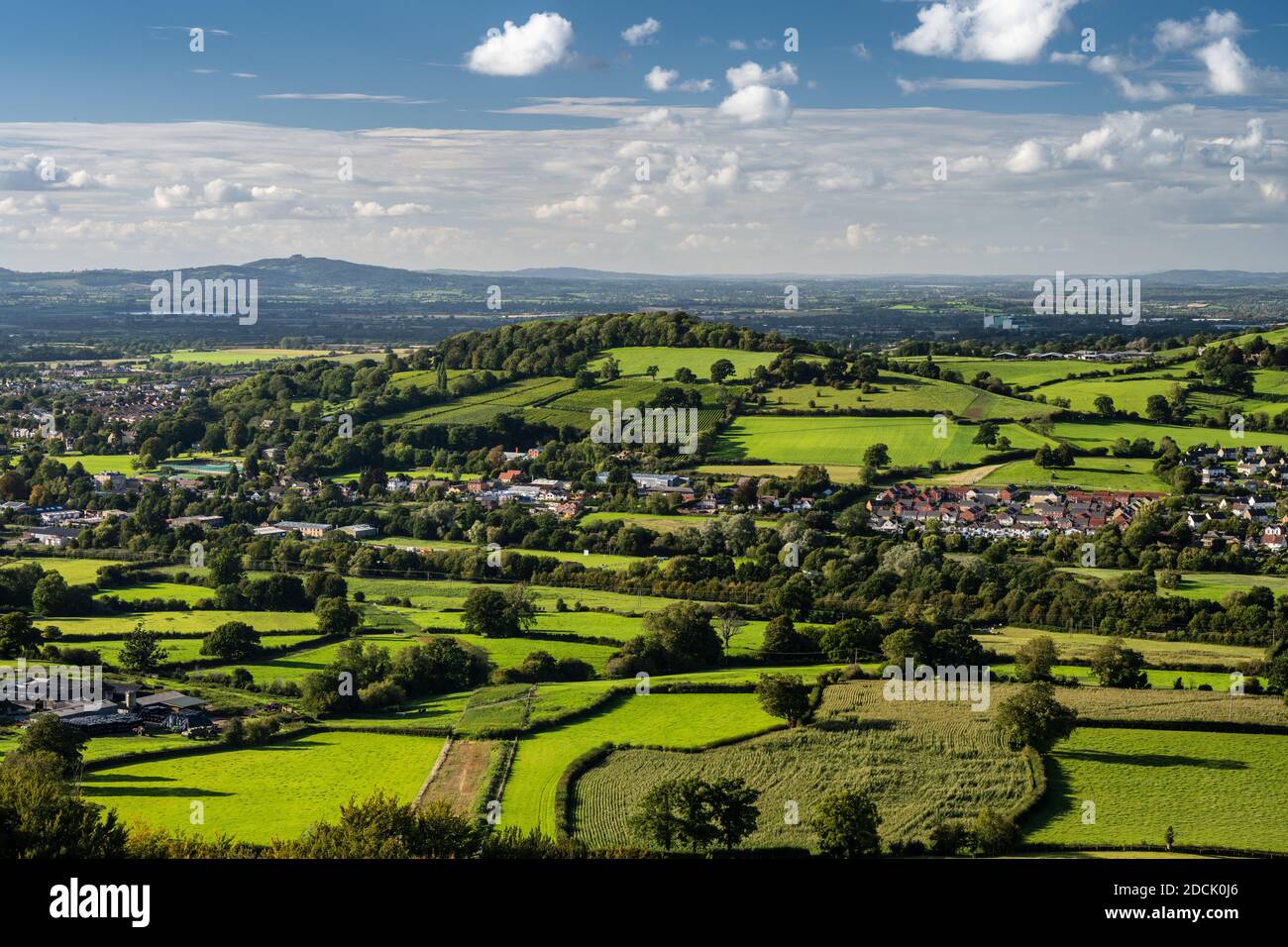 Sun shines on Doverow Hill, Stonehouse village and the pastoral lanscape of the Severn Valley in Gloucestershire. Stock Photo