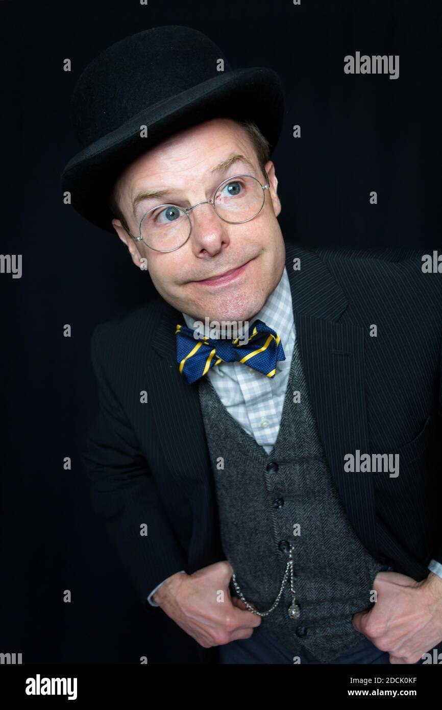 Portrait of Well Dressed Man in Bowler Hat Smiling. Concept of Classic English Gentleman. Stock Photo
