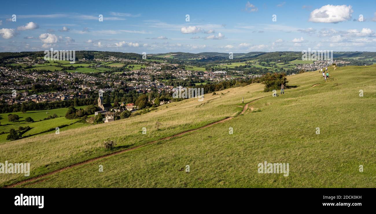 People stroll and walk dogs on Selsley Common above Stroud in the rolling Cotswold Hills of Gloucestershire. Stock Photo
