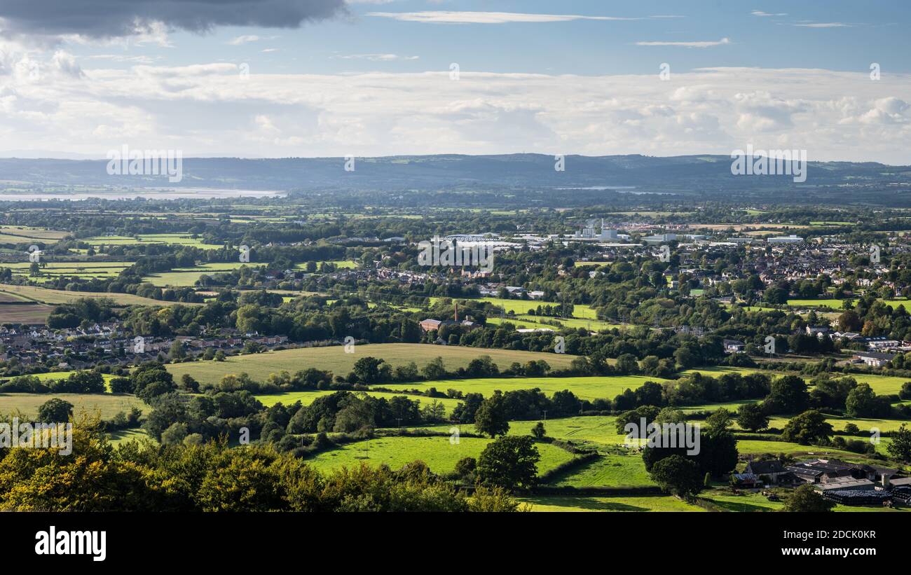 Sun shines on the town of Stonehouse and the pastoral landscape of the Severn Valley in Gloucestershire, with the Forest of Dean behind. Stock Photo