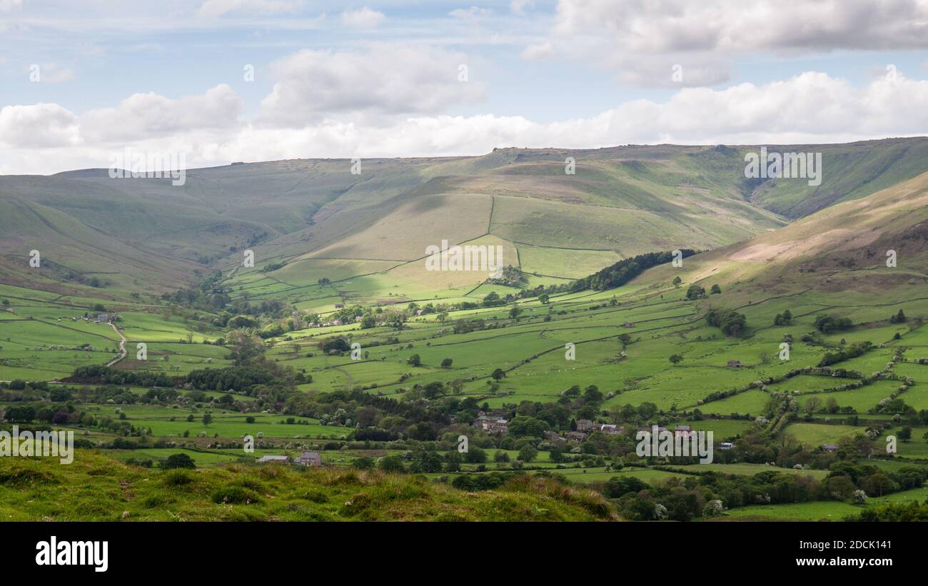 The moors of Kinder Scout rise above the Vale of Edale in Derbyshire's Peak District. Stock Photo