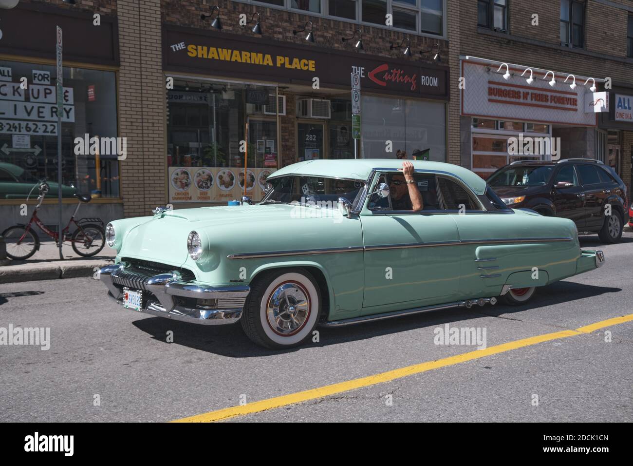 vintage Pontiac teal coloured car on streets of Byward area of Ottawa