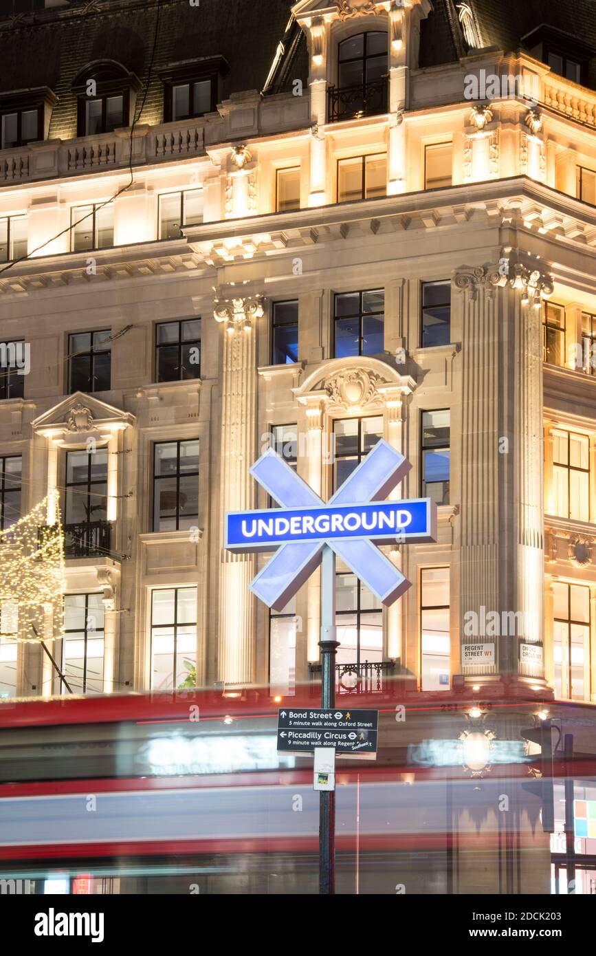 Sony Playstation 5 PS5 Launch Underground Station Entrance Sign Buttons Icons Logo Night Neon Lights in Oxford Circus, West End, London, WC1 Stock Photo