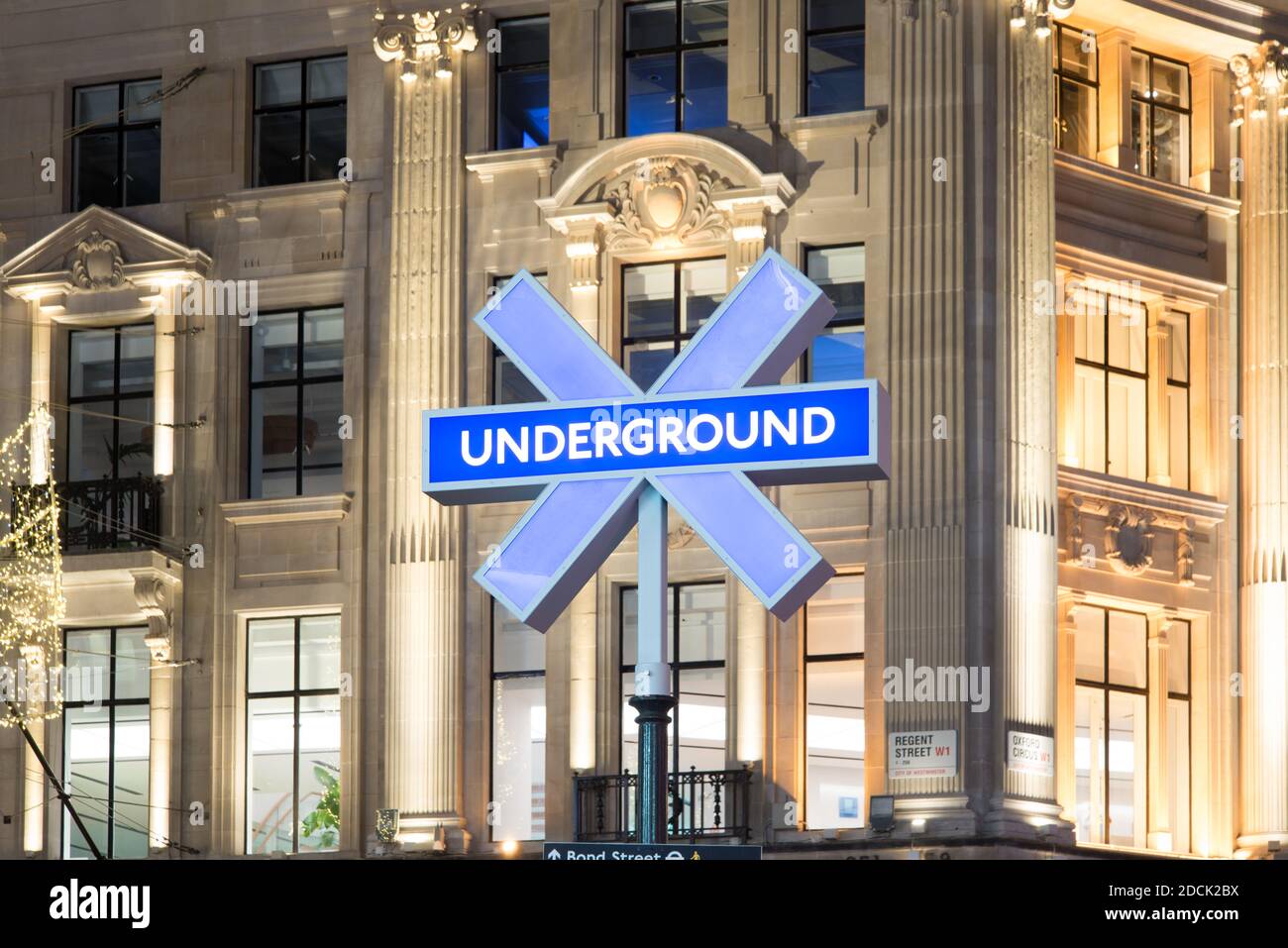 Sony Playstation 5 PS5 Launch Underground Station Entrance Sign Buttons Icons Logo Night Neon Lights in Oxford Circus, West End, London, WC1 Stock Photo
