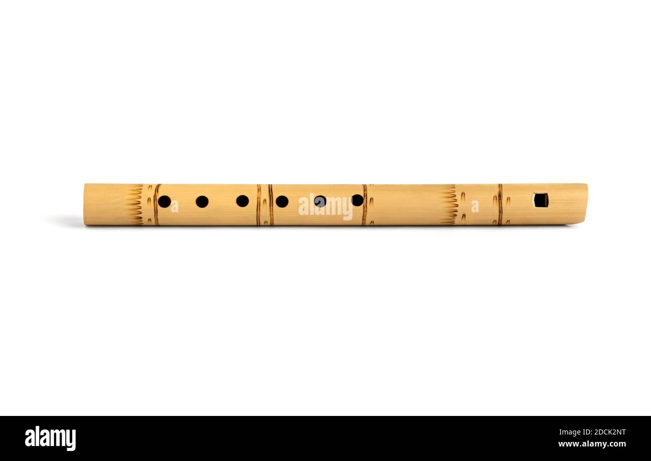 Peruvian flute isolated on white with shadow. South American national musical instrument. A folk musical instrument of the Indians. Flute isolated. Stock Photo