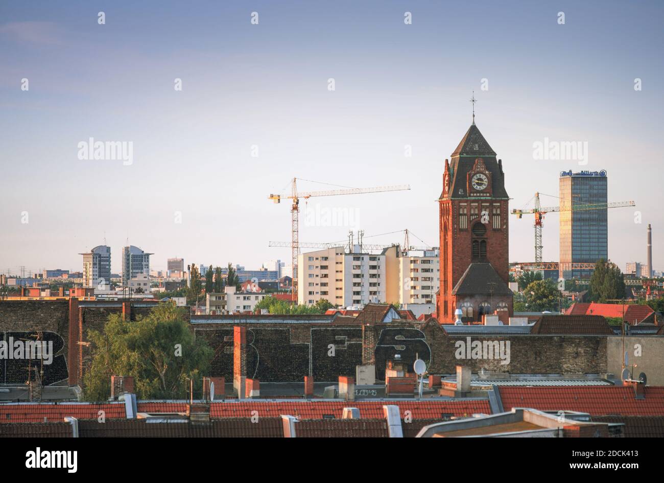 Cityscape view over Berlin Neukölln with the Martin Luther Kirche in the foreground and the Treptowers in the background in 2017, Berlin, Germany Stock Photo