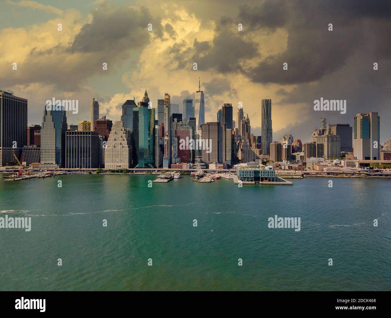 Dusk at lower Manhattan skyline on the East River at New York, New York ...