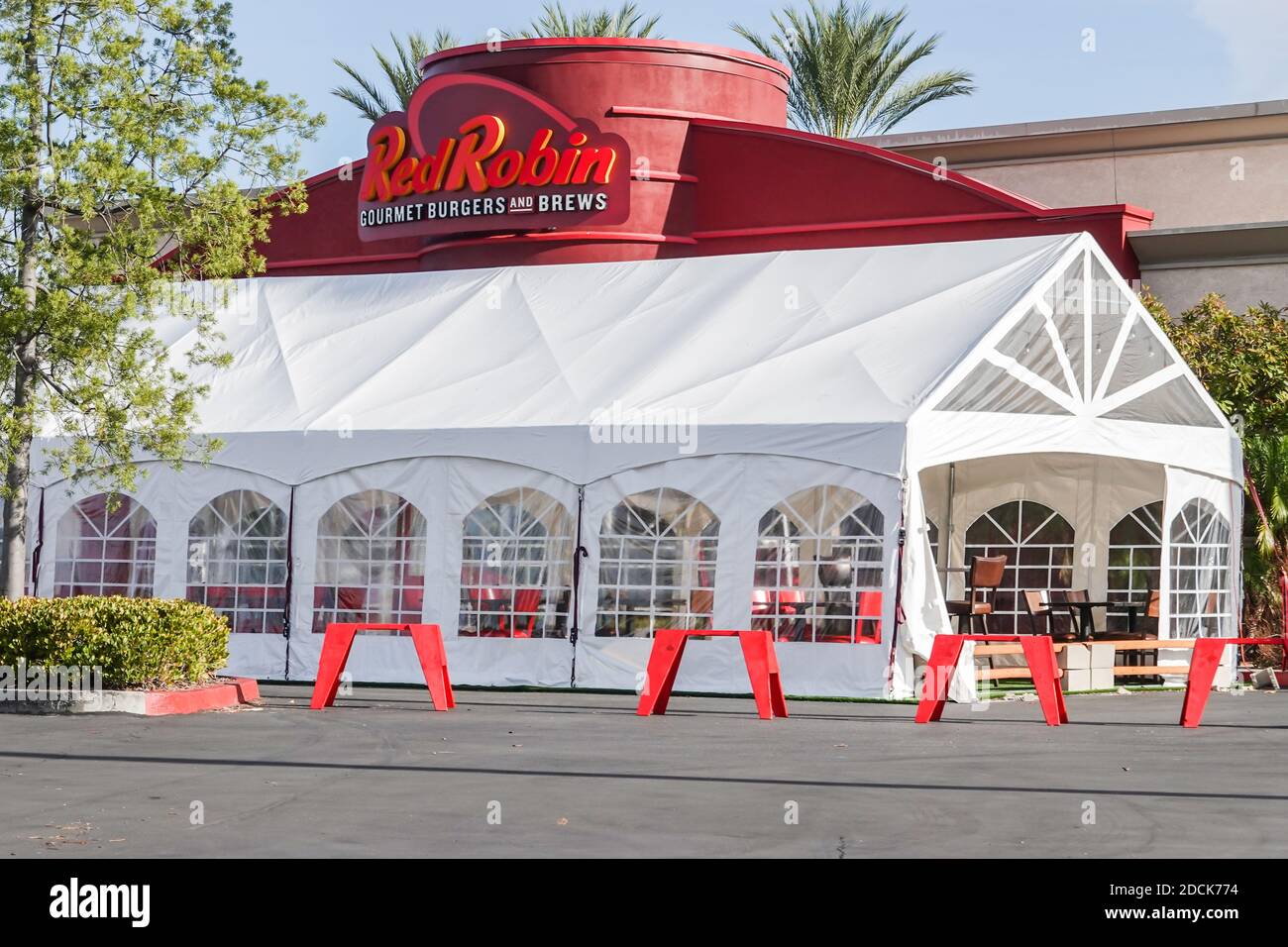 Red Robin restaurant sign and logo with  marquee outdoor eating area due to covid 19 and coronavirus regulations and restrictions in California USA Stock Photo