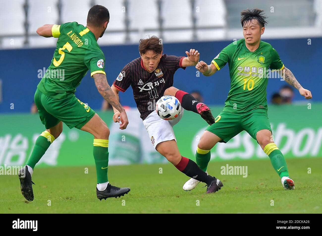 Doha, Qatar. 21st Nov, 2020. Cho Young-Wook (C) of FC Seoul vies with Zhang Xizhe (R) and Renato Augusto of Beijing FC during the group E match between FC Seoul of South Korea and Beijing FC of China at the AFC Champions League 2020 in Doha, capital of Qatar, Nov. 21, 2020. Credit: Nikku/Xinhua/Alamy Live News Stock Photo