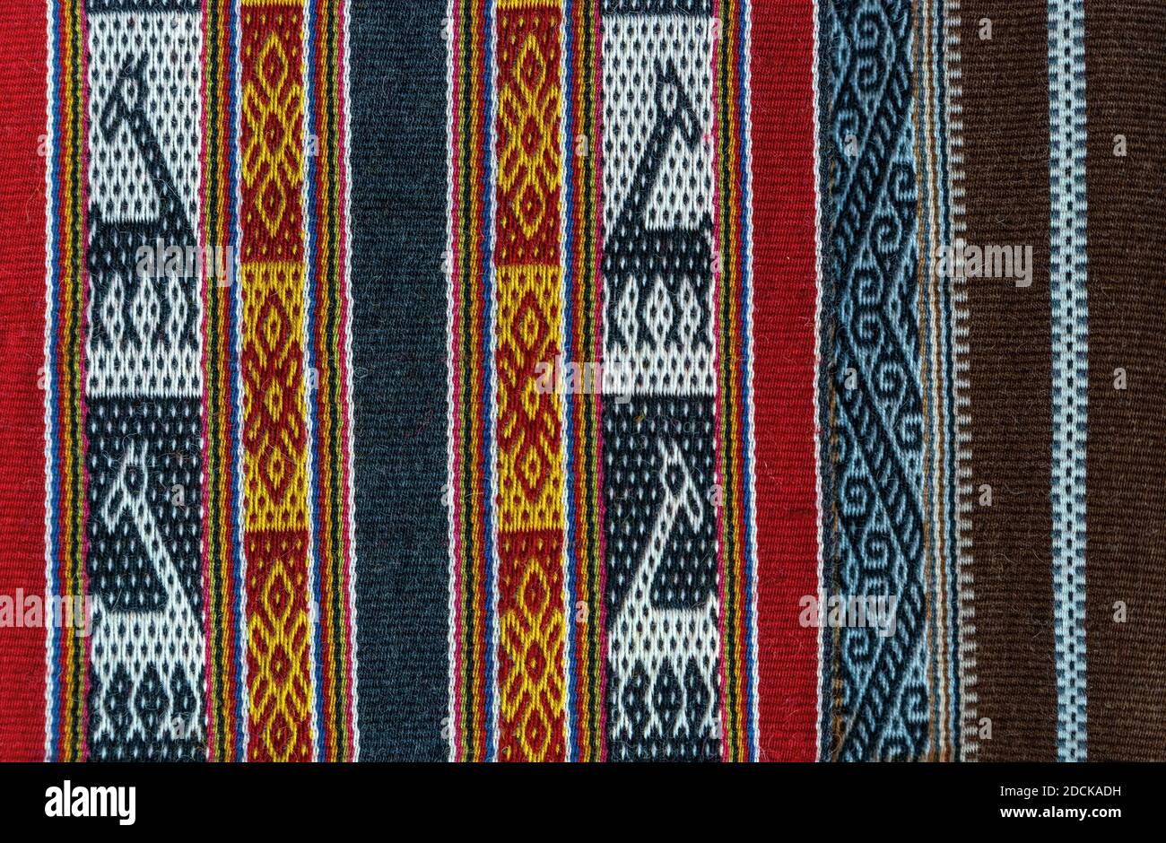 Andes textile with llama pattern on a local art and craft market, Cusco, Peru. Stock Photo