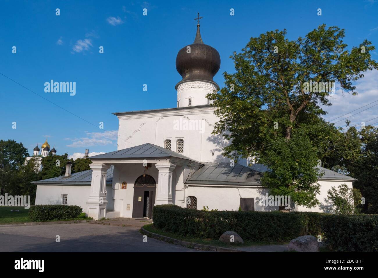 Assumption church from Paromenya (Uspenskaya church, XVI century) and its bell tower. Pskov city, Pskov Region (Pskovskaya oblast), Russia. Stock Photo