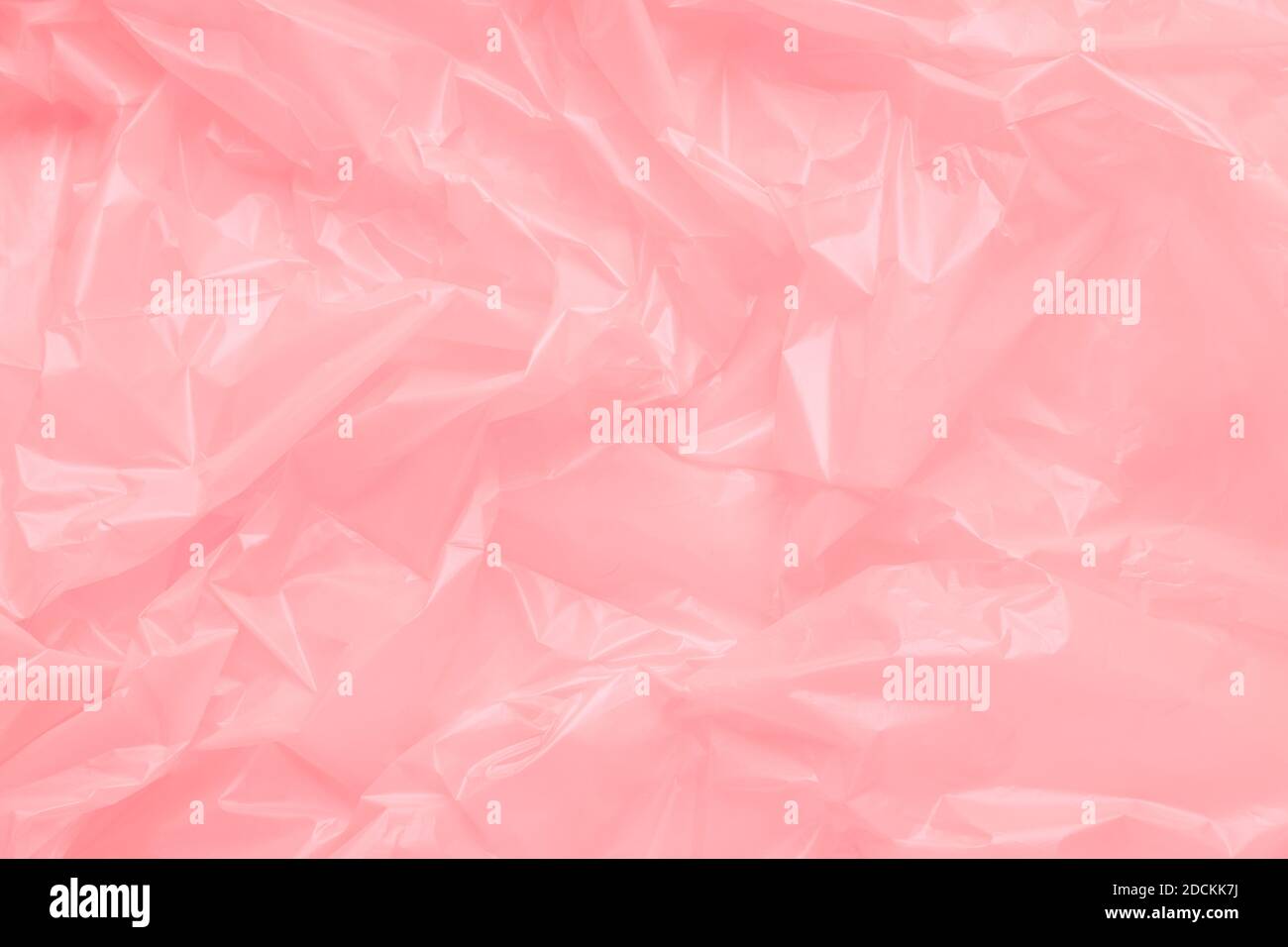 Close up Texture of a Pink Plastic garbage Bag. Pink Polyethylene Film Stock Photo