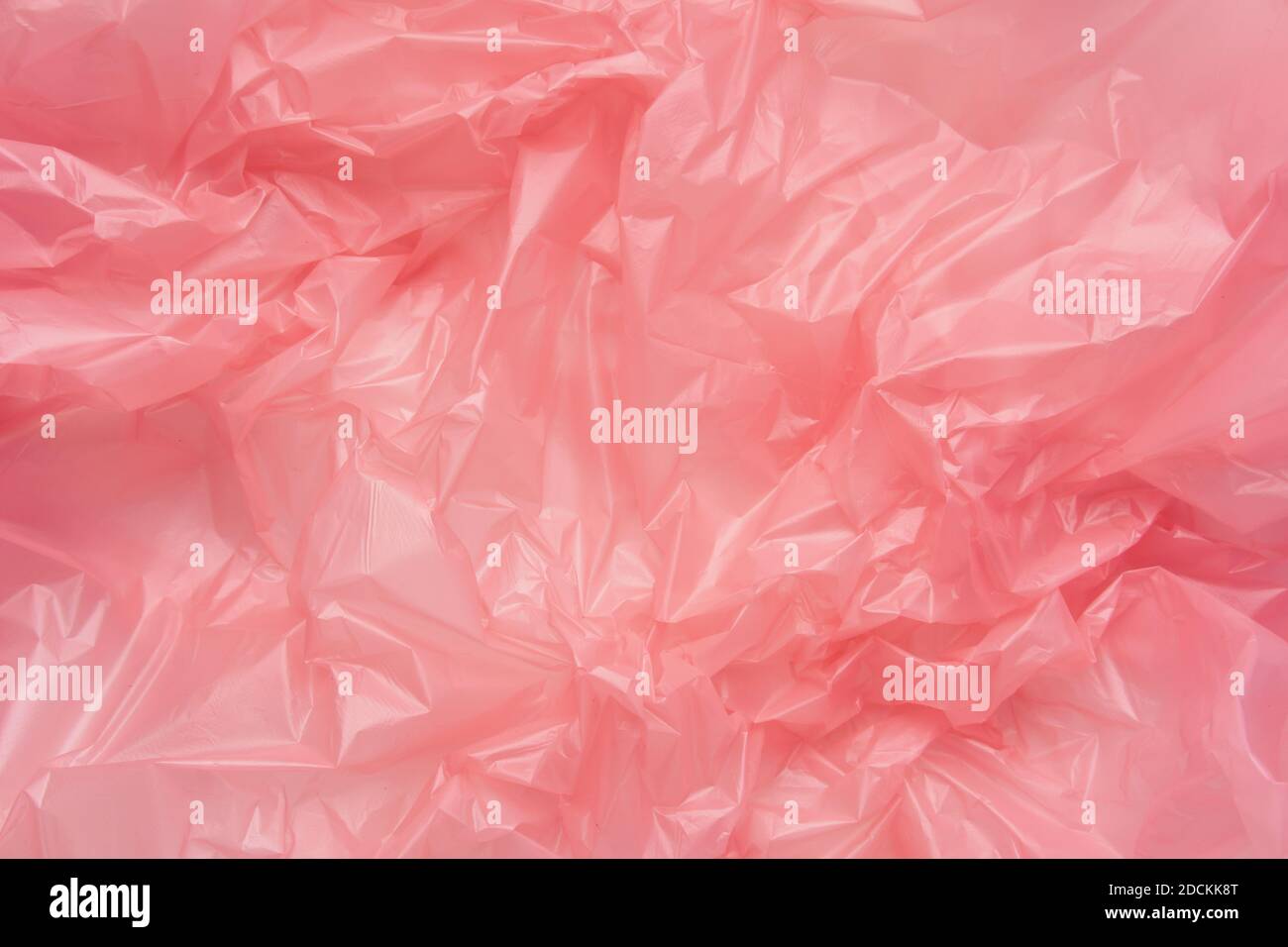 Close up Texture of a Pink Plastic garbage Bag. Polyethylene Film Stock Photo