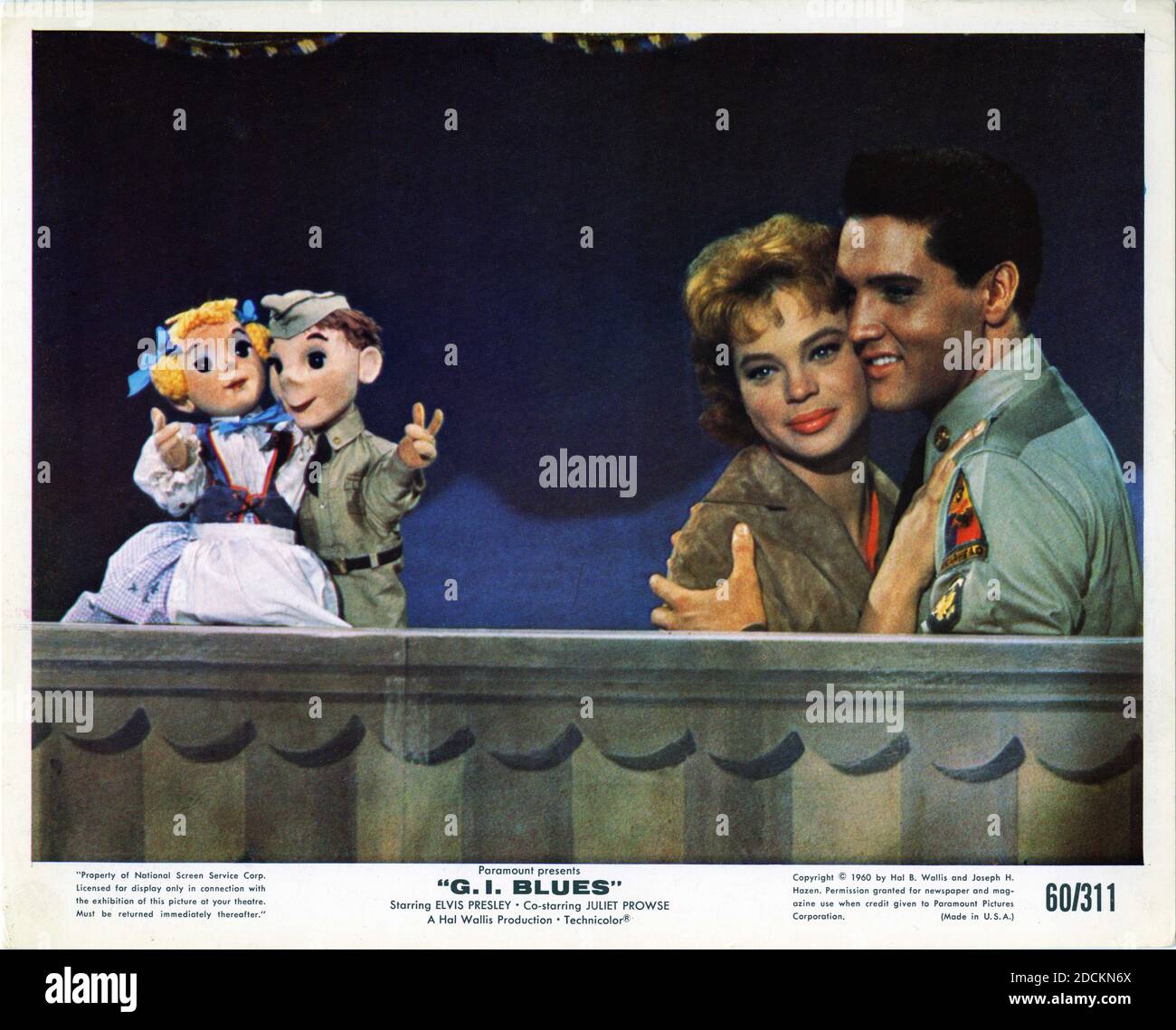 JULIET PROWSE and ELVIS PRESLEY with Puppets in G. I. BLUES 1960 director NORMAN TAUROG costume design Edith Head Hal B. Wallis Productions / Paramount Pictures Stock Photo