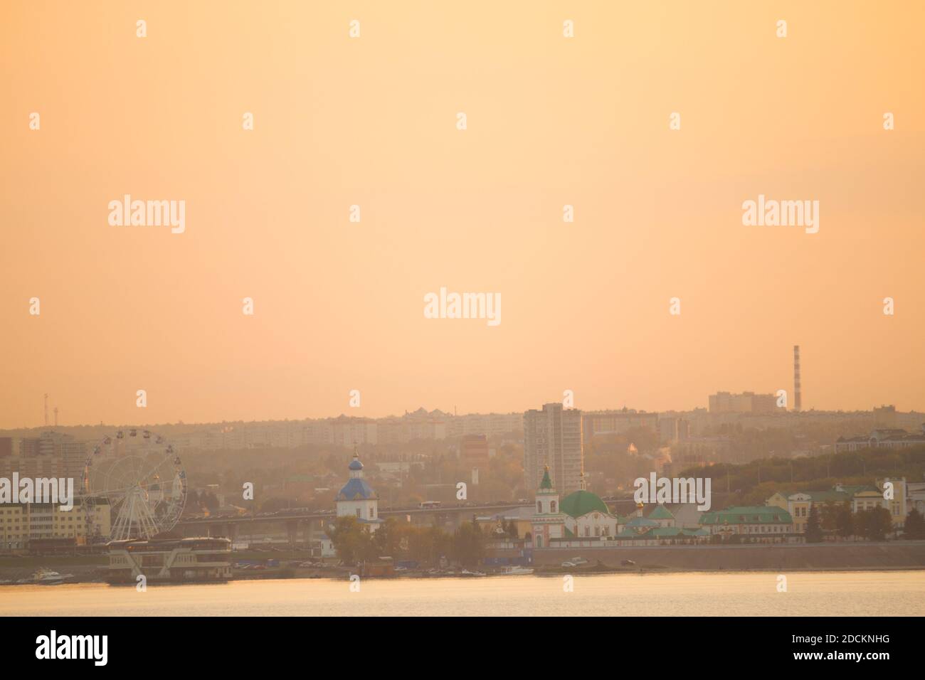 View on a small city by the river Stock Photo - Alamy