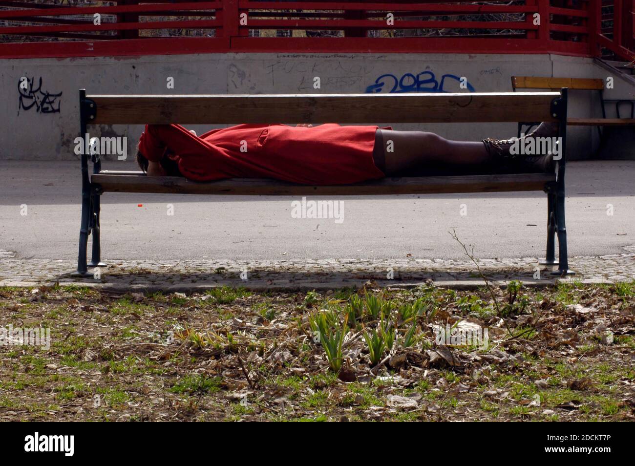Woman asleep on park bench hi-res stock photography and images - Alamy