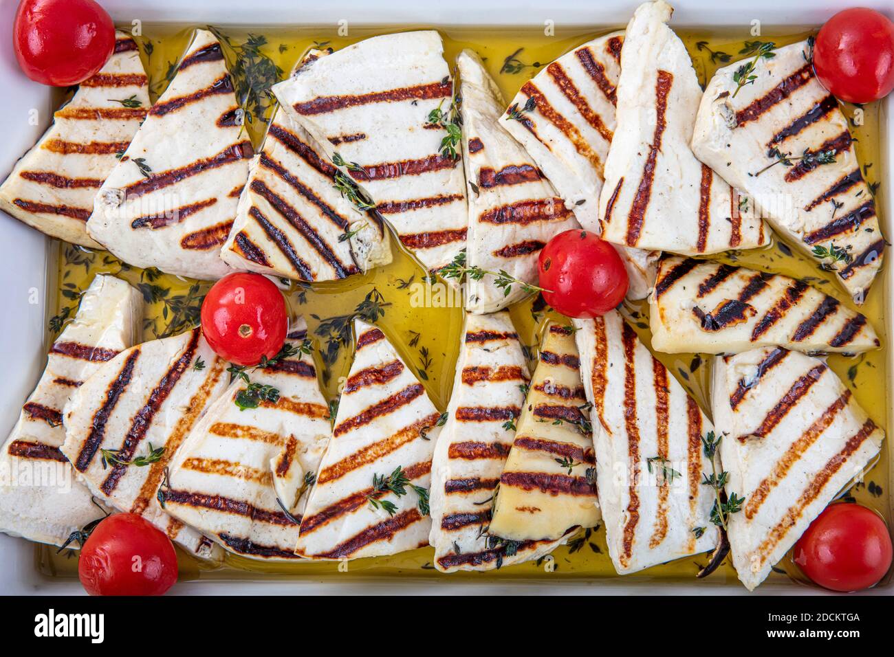 Turkish cuisine appetizers; Fried Halloumi cheese in the grill pan Stock Photo Alamy