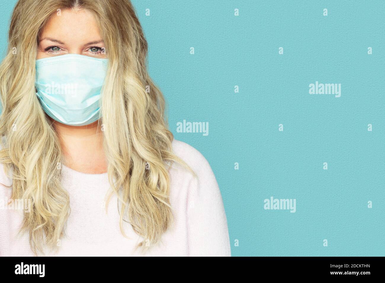 Beautiful blonde female in mask hi-res stock photography and images - Alamy