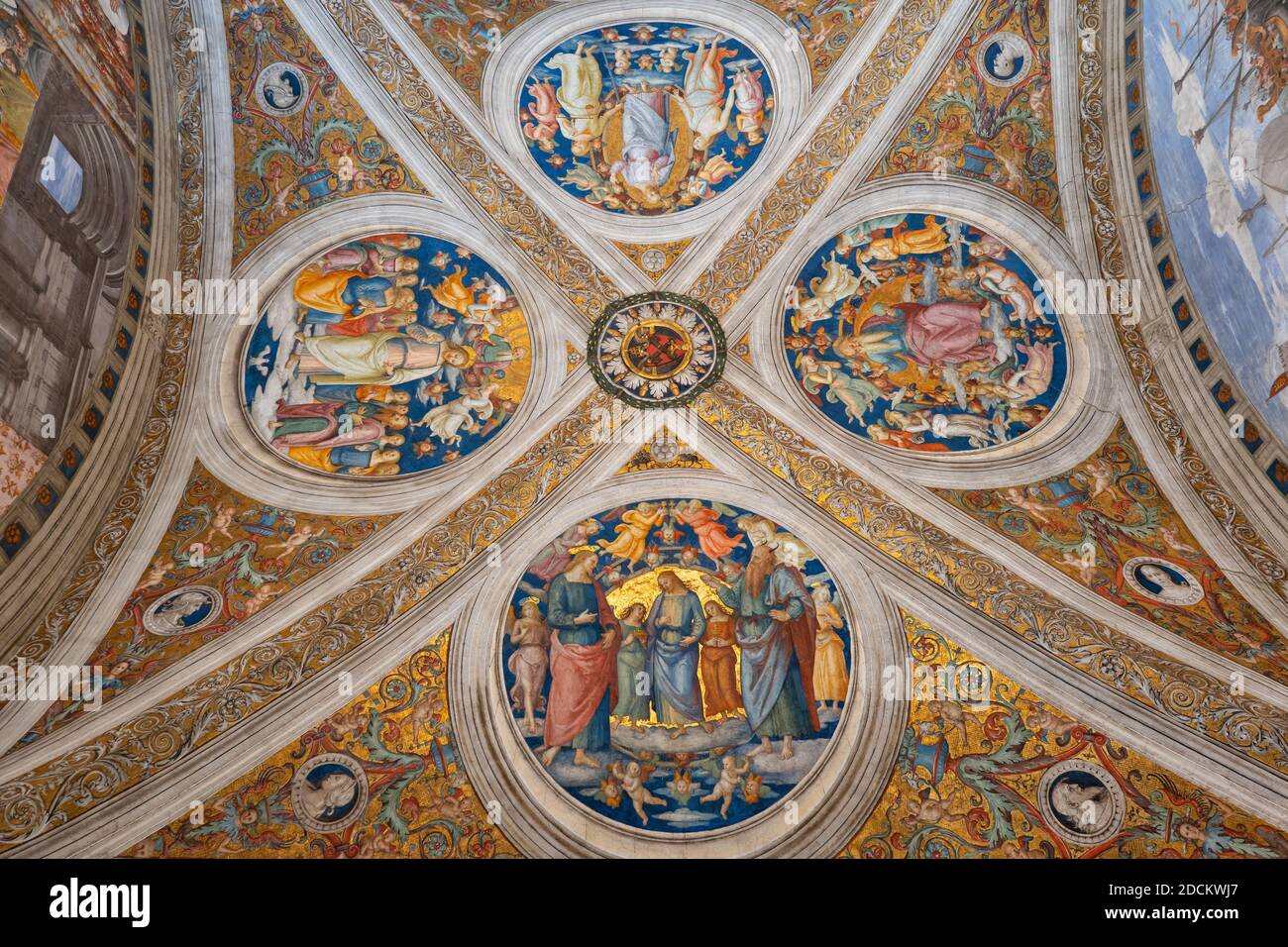 Ceiling with four medallions the Most Holy Trinity by Pietro Vannucci(Perugino) in Room of the Fire in the Borgo, Raphael's Rooms, Vatican Museums, Ro Stock Photo