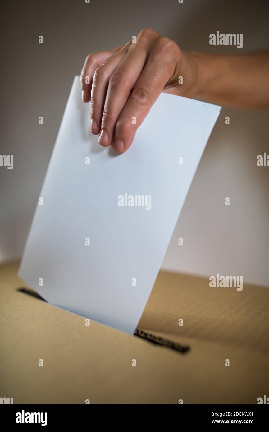 Polling Ballet Conceptual image of a person voting, casting a ballot at a polling ...