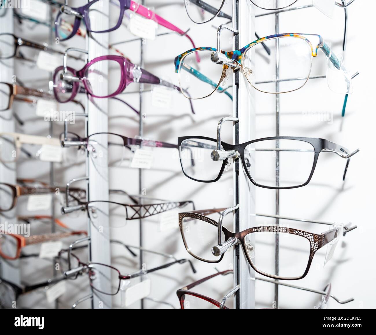Rows of spectacle frames in optics. Glasses shop Stock Photo