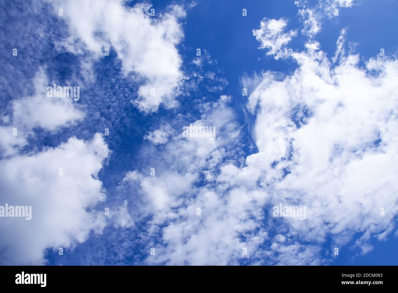 Blue sky background with white fluffy clouds in warm summer day Stock ...