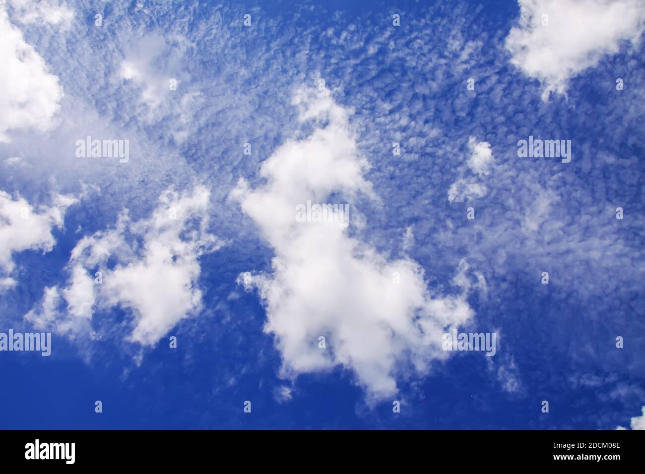 Blue sky background with white fluffy clouds in warm summer day Stock ...