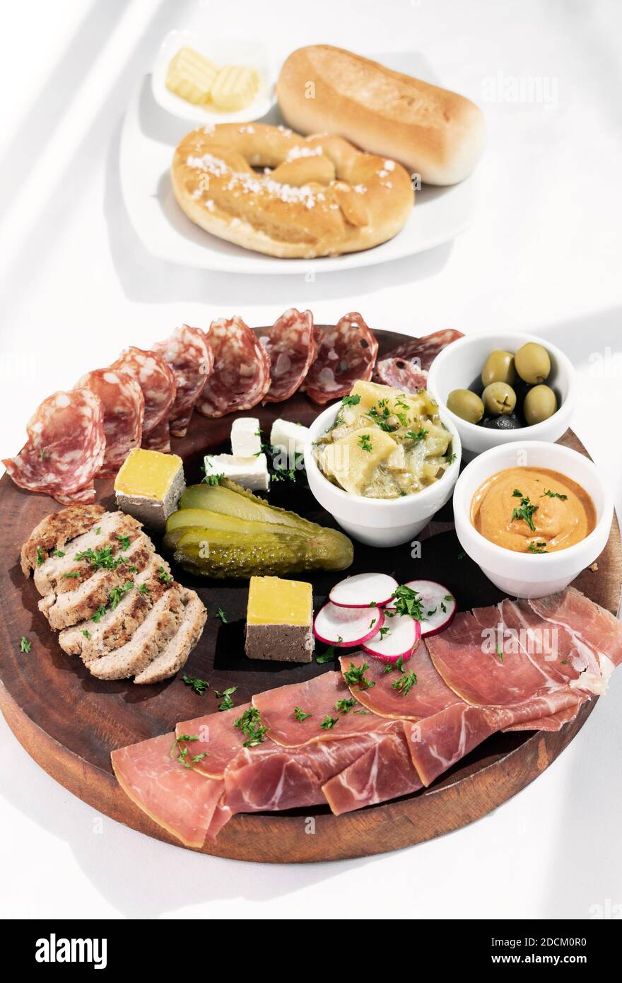 german cold cuts tapas snack platter with meats and bread on white background Stock Photo