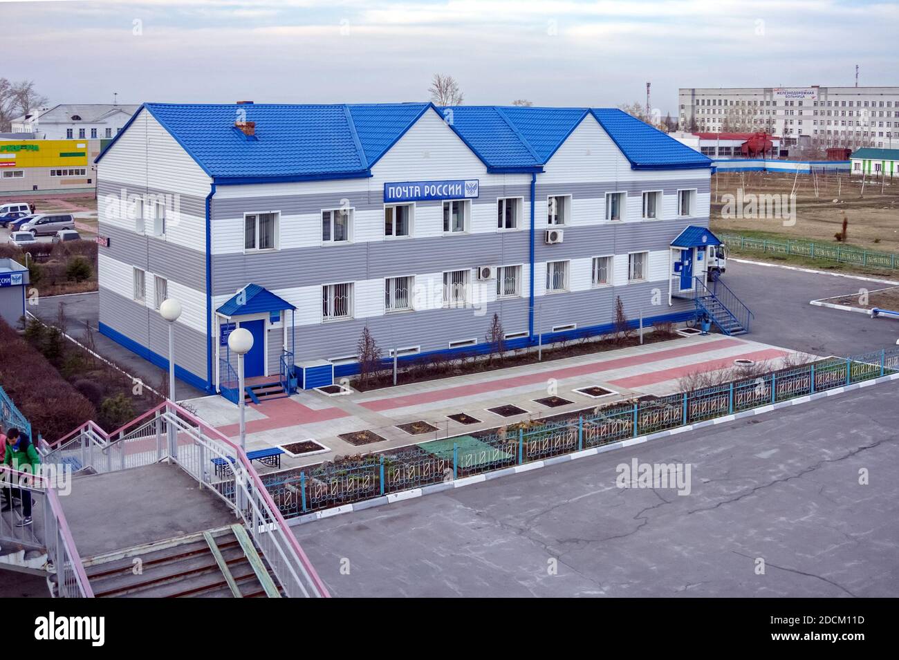 View from the rail-overroad bridge to the office of a large Russian federal state company Russian Post at a railway station in the city of Barabinsk. Stock Photo