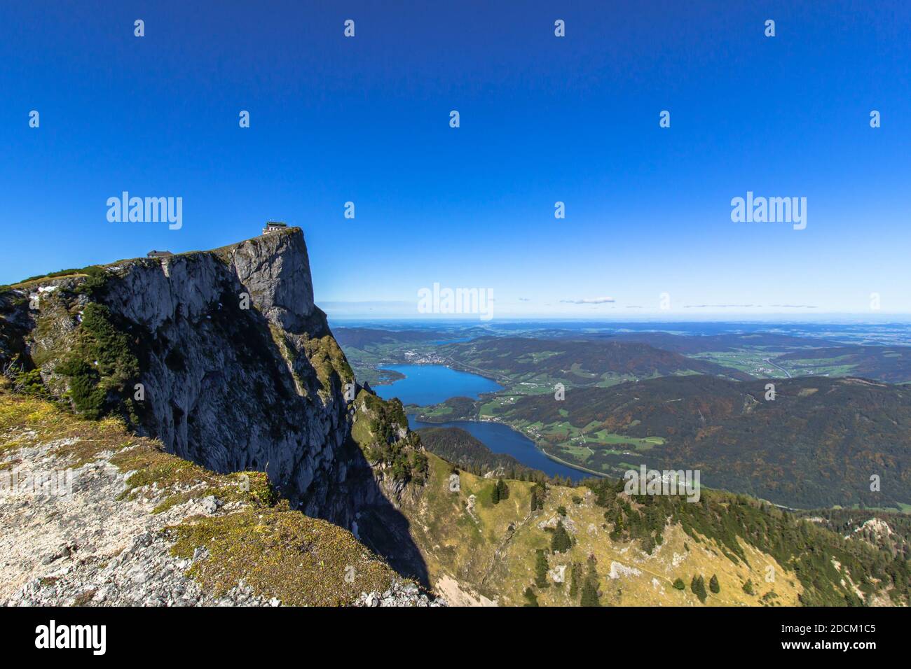 View of lake Mondsee from top of Schafberg,Austria,Salzkammergut region.Blue sky, Alps mountains,Salzburg, nearby Wolfgangsee, Attersee.Hiking in Alps Stock Photo