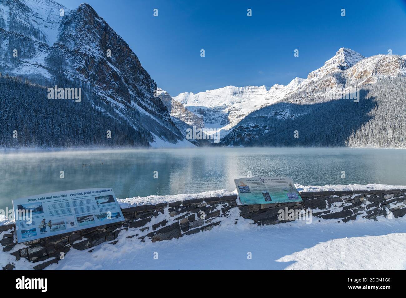 Lake Louise in early winter sunny day morning. Mist floating on ...