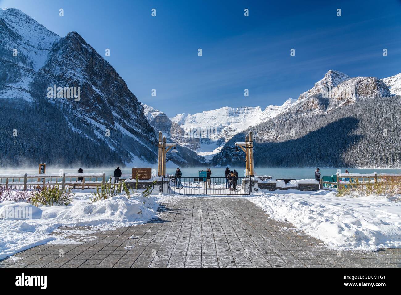 Fairmont Chateau Lake Louise in early winter sunny day morning. Mist ...