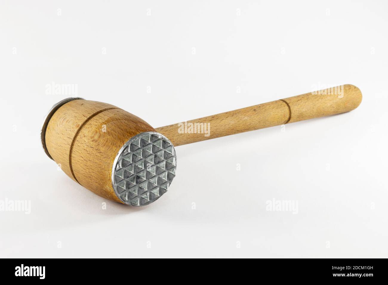 Old rustic wooden meat mallet hammer, isolated on white background. Stock Photo