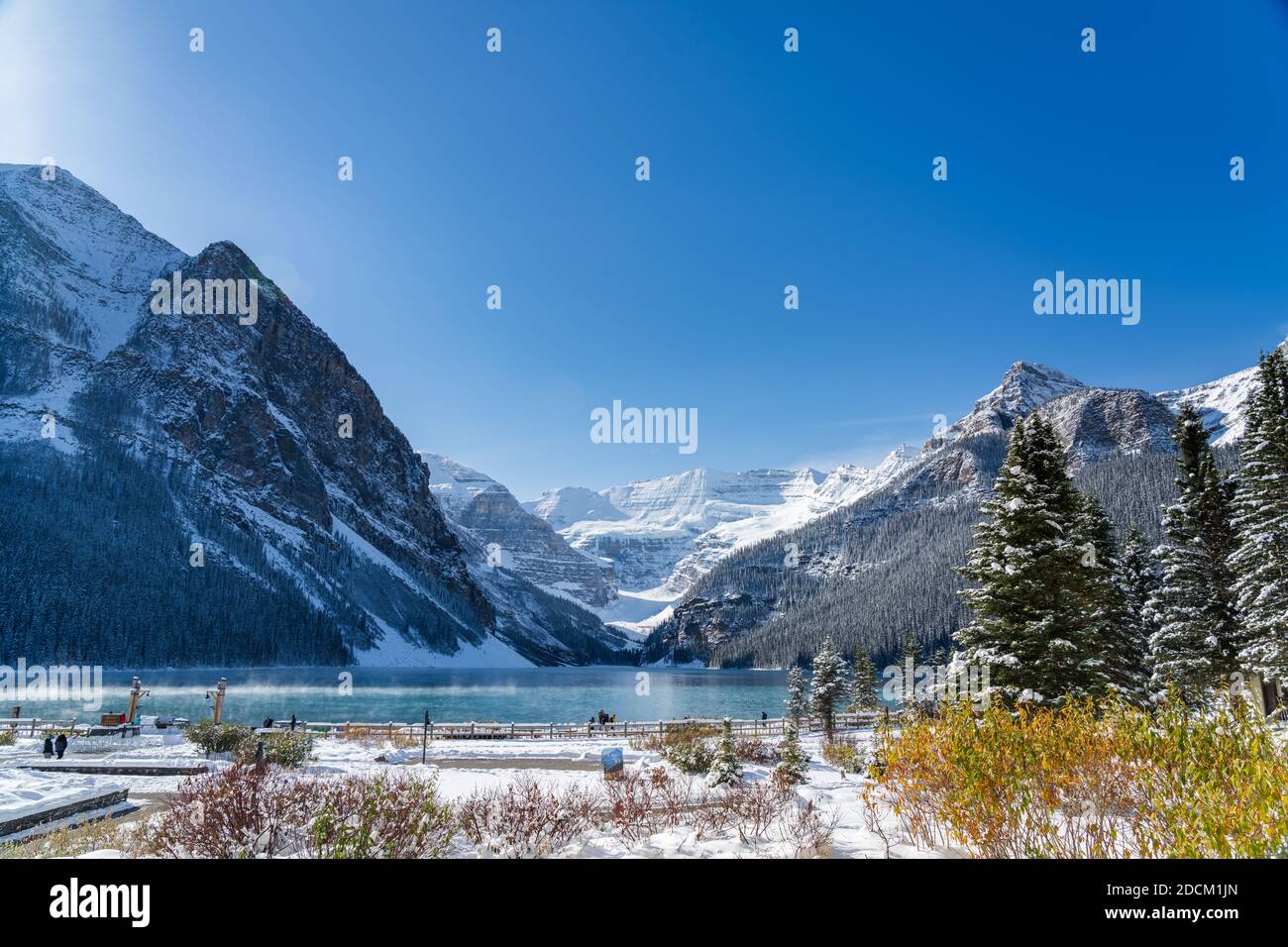 Fairmont Chateau Lake Louise in early winter sunny day morning. Mist ...