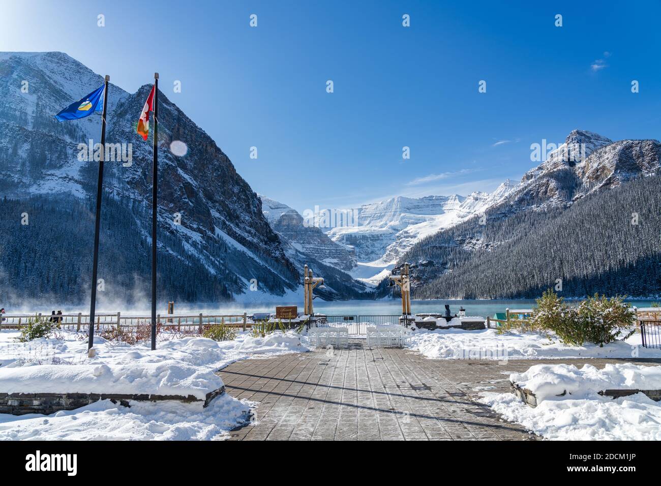 Fairmont Chateau Lake Louise in early winter sunny day morning. Mist ...