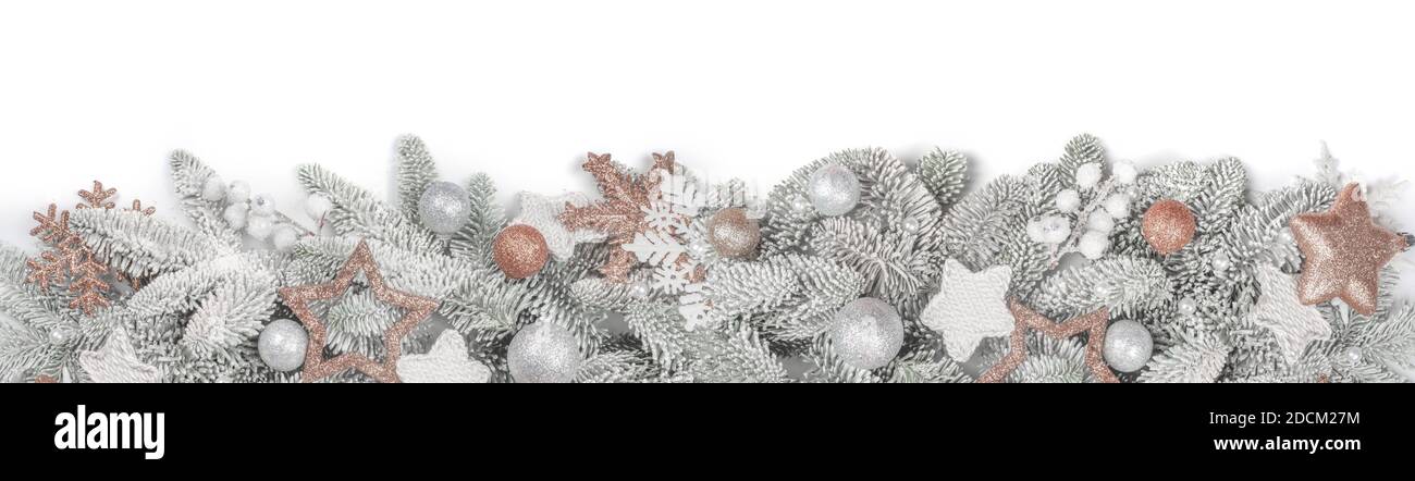 Frosted fir tree twigs and Christmas decorative bauble balls isolated on white background with copy space for text template flat lay top view design Stock Photo