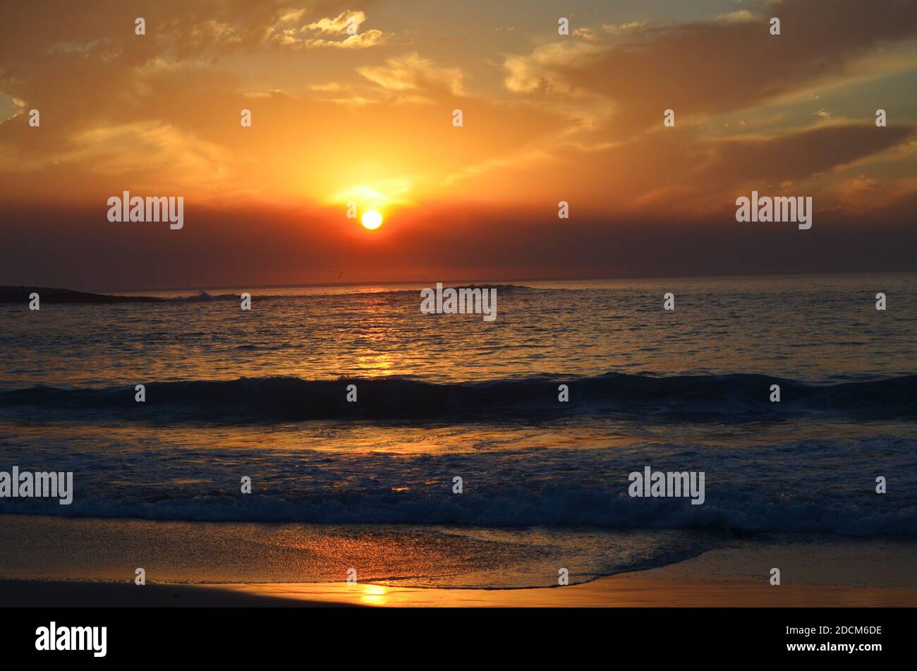 Sunset on the beach Stock Photo - Alamy