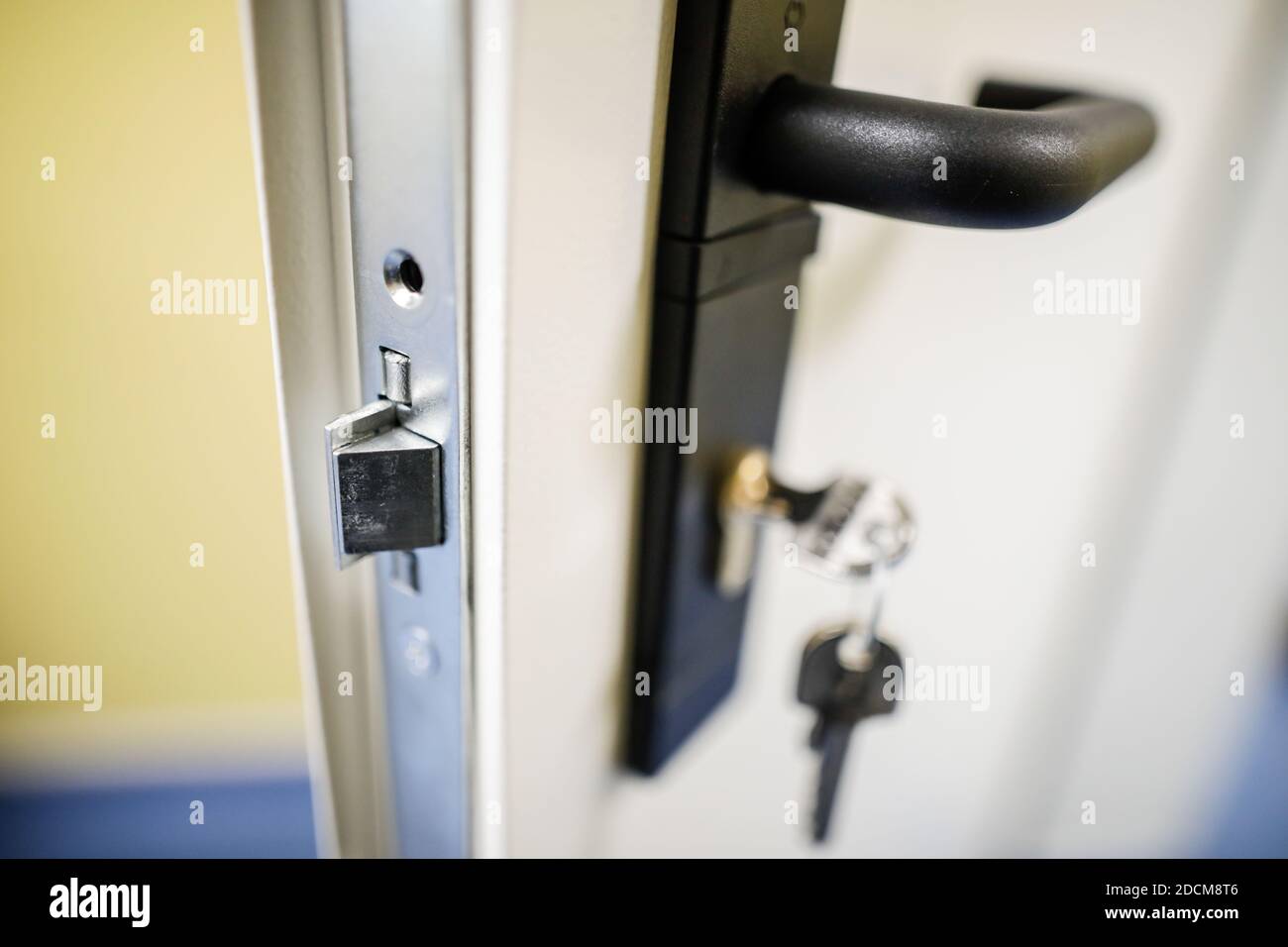 Shallow depth of field (selective focus) image with a metal door lock. Stock Photo