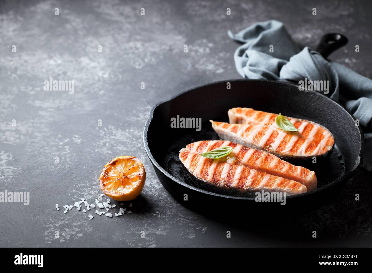 Grilled salmon steaks in cast iron pan, selective focus Stock Photo Alamy