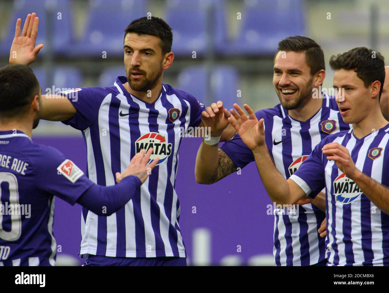 22 November 2020, Saxony, Aue: Football: 2nd Bundesliga, FC Erzgebirge Aue - SV Darmstadt 98, 8th matchday, at the Erzgebirgsstadion. Aues Pascal Testroet (3rd from left) cheers after his goal for 1:0 with Calogero Rizzuto (l-r), Ognjen Gnjatic and Clemens Fandrich. Photo: Robert Michael/dpa-Zentralbild/dpa - IMPORTANT NOTE: In accordance with the regulations of the DFL Deutsche Fußball Liga and the DFB Deutscher Fußball-Bund, it is prohibited to exploit or have exploited in the stadium and/or from the game taken photographs in the form of sequence images and/or video-like photo series. Stock Photo