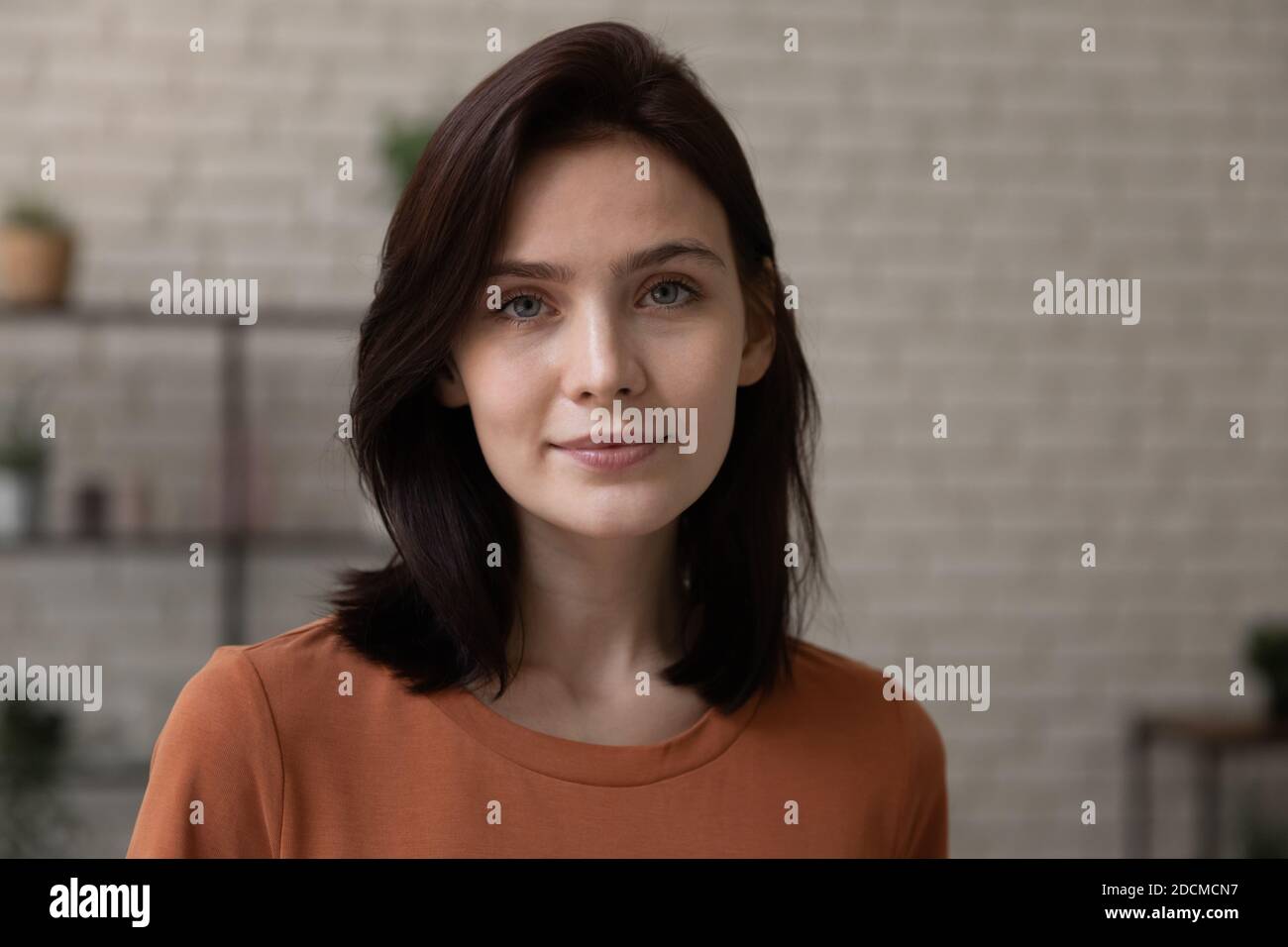 Head shot close up portrait of beautiful millennial 20s woman. Stock Photo