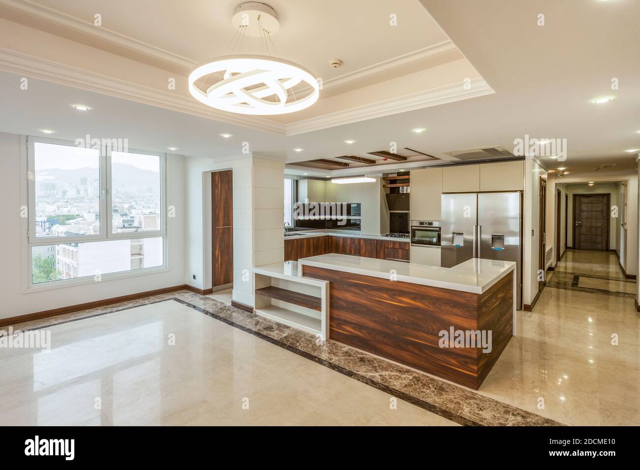 View of the kitchen and living room empty of appliances Stock Photo