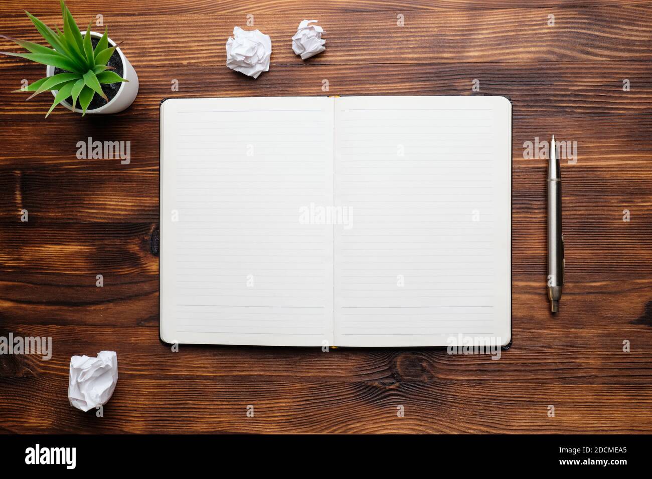 Diary open on a wooden table copy space. Stock Photo