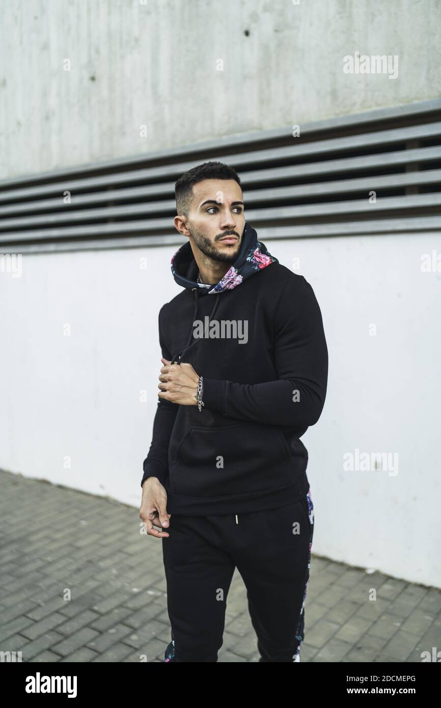 A street style of a European elegant man with a stylish haircut and ...