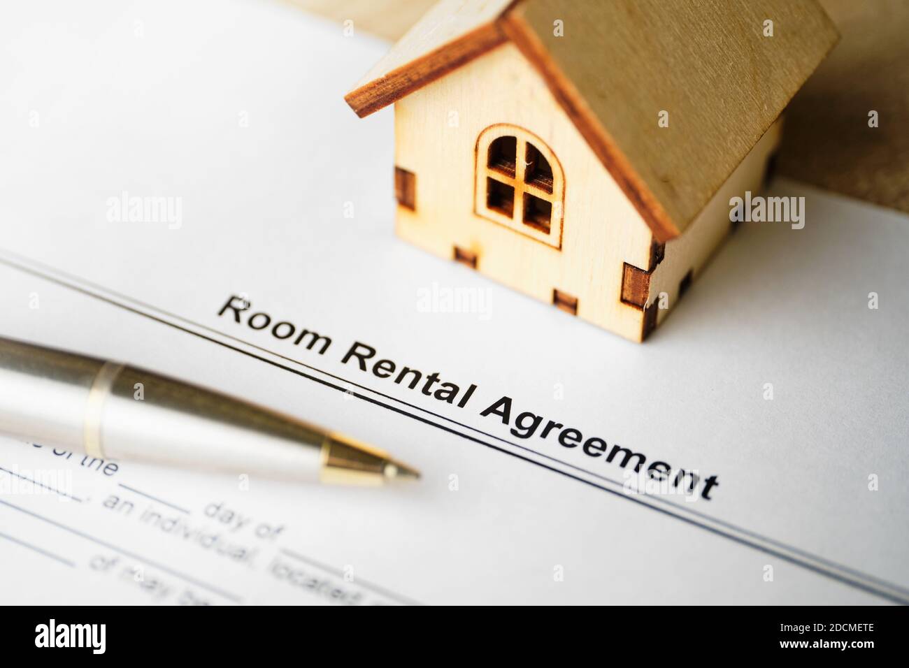 The document Room Rental Agreement is ready for signing. Stock Photo