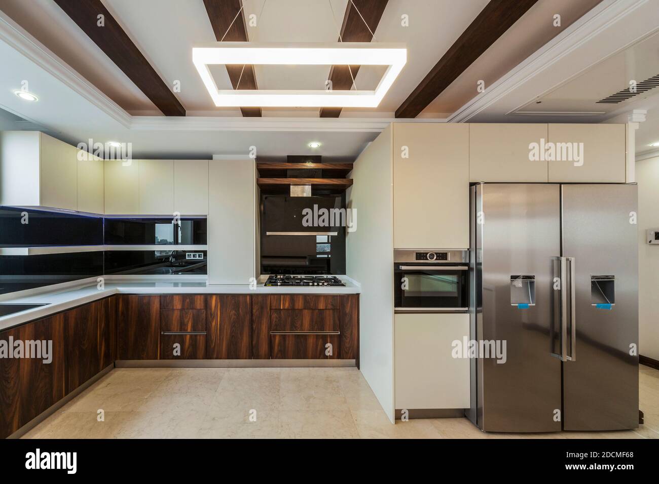 View of the kitchen and living room empty of appliances Stock Photo - Alamy
