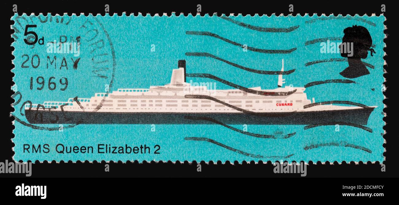 British Vintage cancelled postage stamp. RMS Queen Elizabeth circa 1969. 5 pence stamp with clear postmark from Blandford Forum Dorset. Stock Photo