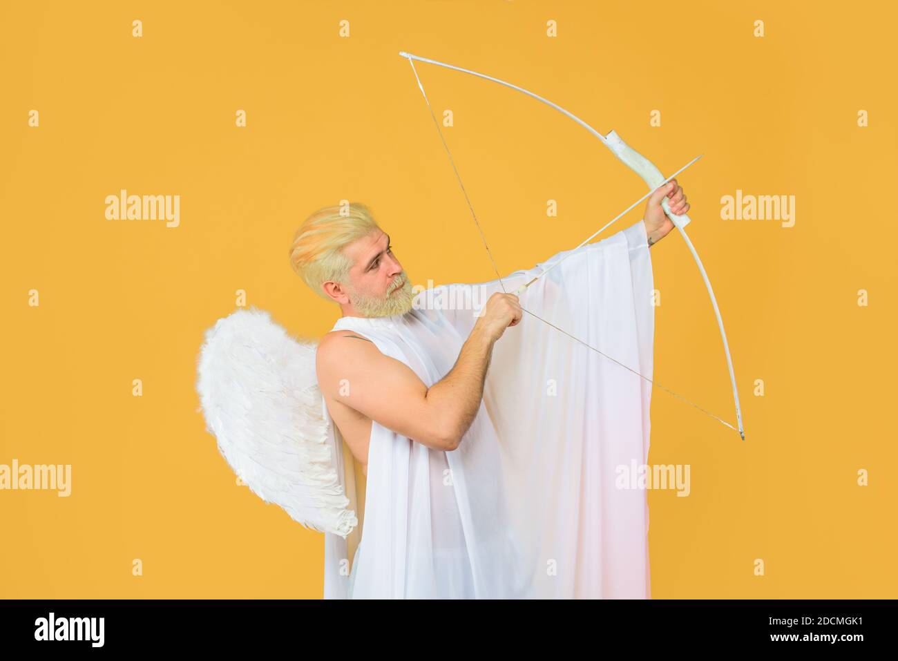 Valentines Day. Valentines cupid. Arrow of love. Cupid throws arrow with bow. Bearded angel with bow and arrow. Cupid angel with bow and arrows Stock Photo